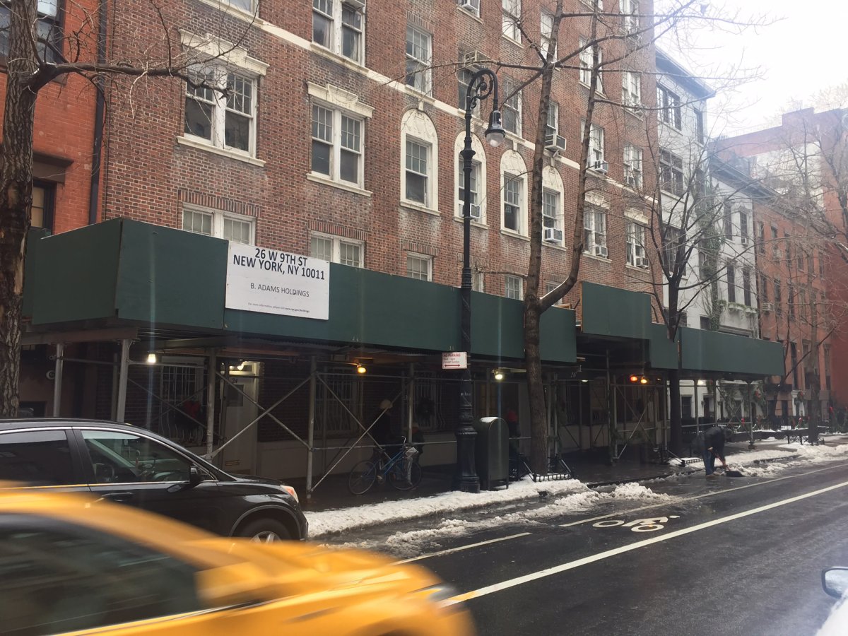 There has been a protective sidewalk shed in front of 26 W. Ninth St. for more than a dozen years, according to neighbors. Photo by Ora McCreary 