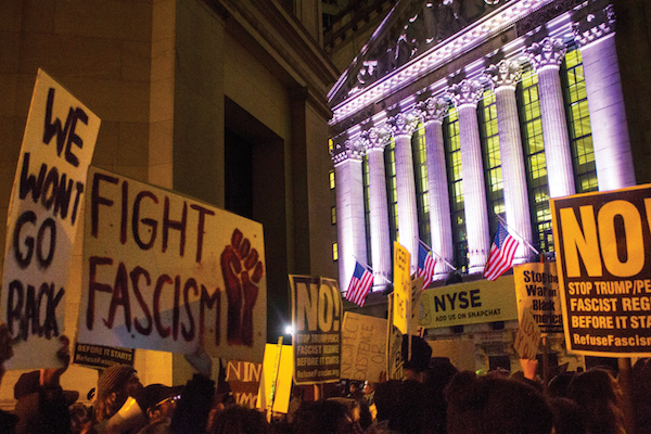 Activists Promise Grassroots Movement to Fight Trump 2 The rally stretched along Wall St. to the site where George Washington first took the oath of office, as well as the New York Stock Exchange (above). Photo by Zach Williams.