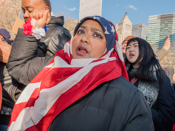 Thousands Protest Trump's Travel Ban at The Battery 3 The Stars-and-Stripes hijab is fast becoming the fashion statement of the season at protests of Trump's Muslim ban. Photo by Milo Hess.