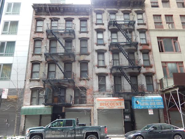 Dust Hasn’t Settled on Illegal Demolitions in Special Districts 1 The owners of these two buildings at 317 and 319 W. 35th St. filed for illegal demolition permits earlier this year and had they received them, would have destroyed 28 units of housing, according to CB4. Photo by Sean Egan.