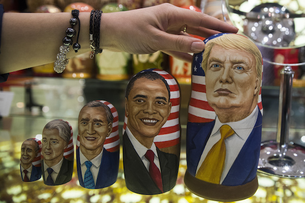 A popular matryoshka “nesting” doll depicts Russia successfully devouring the US presidency. AP Photo/Pavel Golovkin.