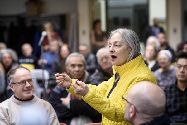 Tenants Stand Tall at Packed Town Hall 3 Hell’s Kitchen resident Maury Sherman (standing) asked, "Where is the Bad Landlord School that they all go to?" Photo by Jordan Rathkopf.