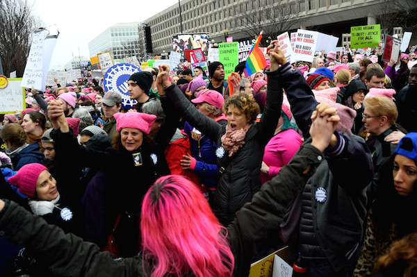 Women Marched on Washington, with the World in Lock Step 1 Hands were joined together and women were in lock step at the Women’s March on Washington. Photo by Donna Aceto.