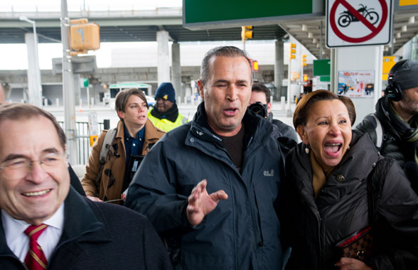 Ban on the Run: Protests at JFK, Jubilation at Brooklyn Courthouse 2 Congressman Jerrold Nadler (left) and Congresswoman Nydia Velazquez (right) escorted Hameed Khalid Darweesh (center), an Iraqi refugee and former translator for the US Army, out of Terminal 4 where he was detained as a consequence of an executive order by President Trump. Photo by Julius Constantine Motal.