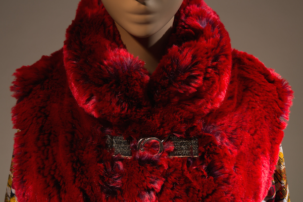 Red faux fur vest with buckle, displayed with gold lame jumpsuit (Xuly.Bët, Womenswear, Fall 2016). Photo courtesy The Museum at FIT.