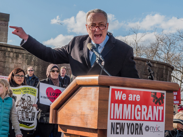 Photo by Milo Hess Sen. Charles Schumer blasted Trump's anti-immigrant executive orders at Sunday's rally at The Battery.