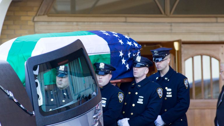 The coffin of Det. Steven McDonald leaves the Parish Center at St. Agnes Cathedral on Friday, Jan. 13, 2017 in Rockville Centre.