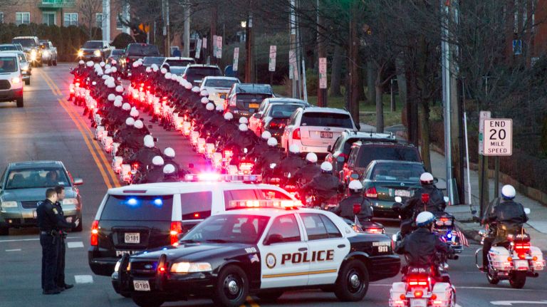 Police escort leads the hearse carrying the coffin of Det. Steven McDonald on Friday, Jan. 13, 2017 in Rockville Centre.