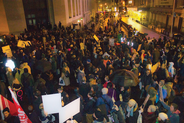 Activists Promise Grassroots Movement to Fight Trump 6 About 1,000 people marched to Wall St. on Jan. 20 to express their opposition to Donald Trump, who was inaugurated earlier that day. Photo by Zach Williams.