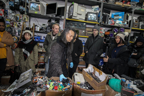 Junk imitates art: Artists turn offbeat Soho electronics store into art project 1 Photo by Tequila Minsky Musician Aki Onda, center, picks out materials for his opening night improvised performance at Argo Electronics on Jan. 5, while Motoko Fukuyama, at right, films the process for her art project called “You Never Know What Idea You Might Have” — which is also the store’s slogan.