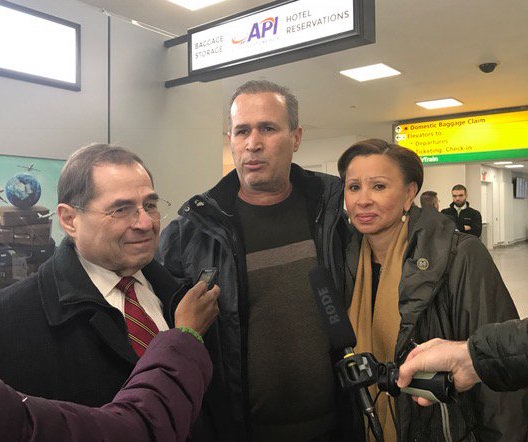 Congressmembers Jerrold Nadler, left, and Nydia Velazquez, right, at J.F.K. Airport on Saturday with Iraqi refugee Hameed Khalid Darweesh after he was released by a federal judge’s order. Photo courtesy Office of Nydia Velazquez
