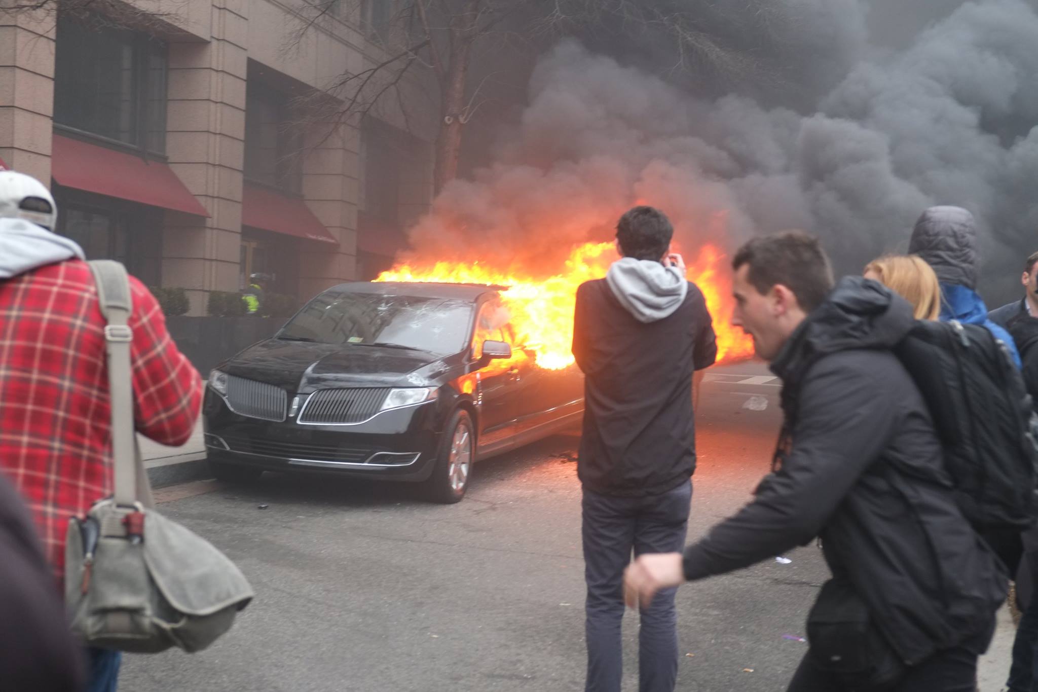 Anarchist protests set a limousine on fire in downtown Washington, D.C., on inauguration day. Photos by John Penley