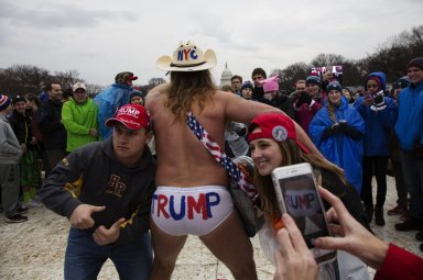 Naked cowboy is seen on Donal Trump’s inauguration day.