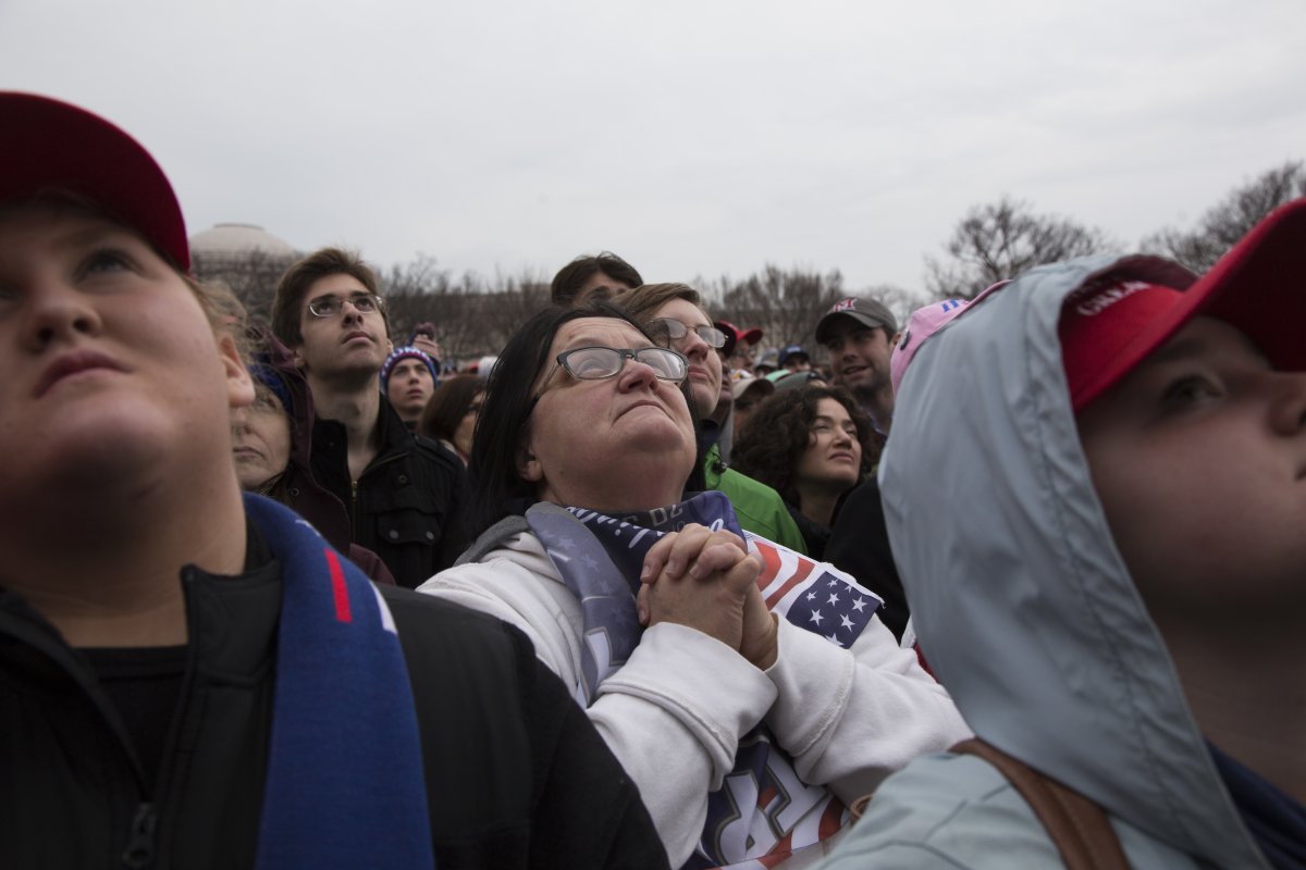 Donald Trump supporters get ecstatic, as Trump and his family members show up in a huge monitor in the National Mall on the presidential inauguration. Their expression is extremely similar to that of Obama supporters 8 years ago. However, United states finds it very divided now.