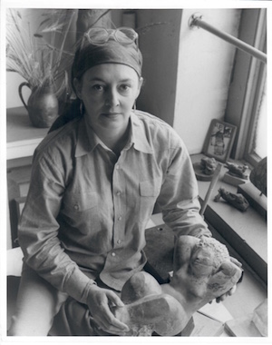 From 1963, Lorrie Goulet at her former studio on W. 21st St., holding an unfinished piece done in alabaster. Photo by Budd Photography.