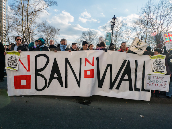 Trump's Travel Ban Challenged in Courts, Airports, Streets, Squares 1 Thousands gathered at The Battery on Sunday, capping a weekend of demonstrations around the country against Trump’s executive order. Photo by Milo Hess.