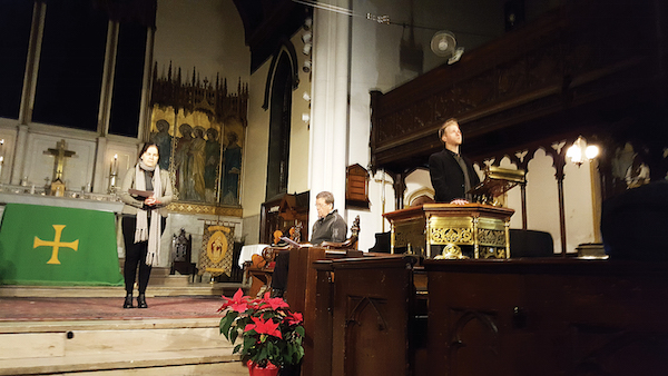 Parishioner Melissa Morgenweck, left, lead prayers before Brandon Snook sang songs that included “Amazing Grace.” Rev. Harding is seated. Photo by Dusica Sue Malesevic.