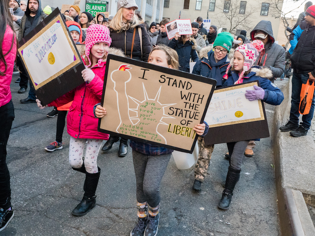 ‘No ban! No wall!’ thousands cry at Battery protest 2 Kids let Trump hear it at the enormous protest. Photo by Milo Hess