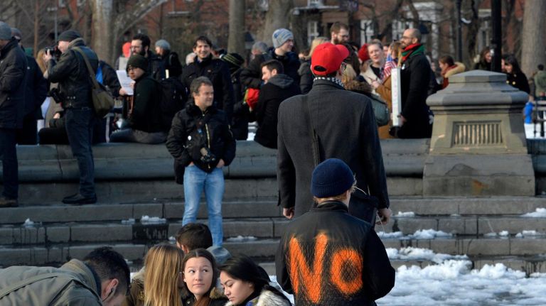 A protester wears a simple message on his jacket during a large immigration rally at Washington Square Park on Saturday, Feb. 11, 2017. The rally was held to challenge the criminalization of immigrants under the NYPD's current Broken Windows policy, before it worsens under President Trump's far-right administration.