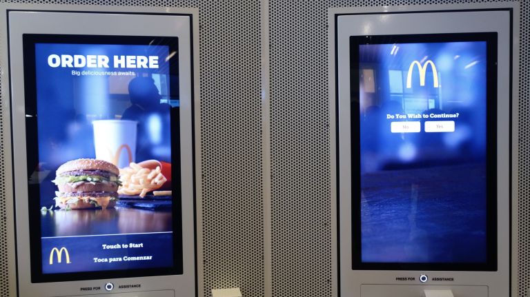 French-inspired McDonald's debuts in NYC 13 Self-service kiosks like these line the walls -- with friendly employees offering guidance for those new to them.