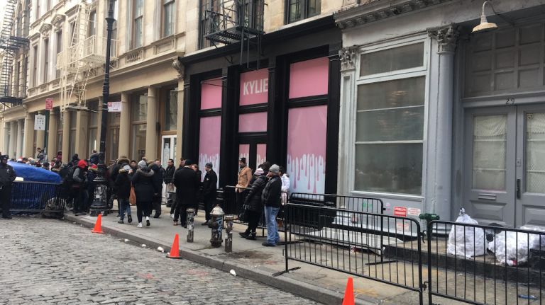 Jenner's pop-up shop left a lot to the imagination, as windows and doors were covered with a bold pink hue to keep whatever's inside as exclusive as possible. 