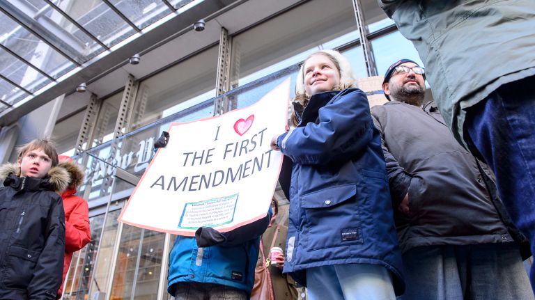 Children attend the March for a Free Press outside the New York Times building in midtown Manhattan on Feb. 26, 2017.
