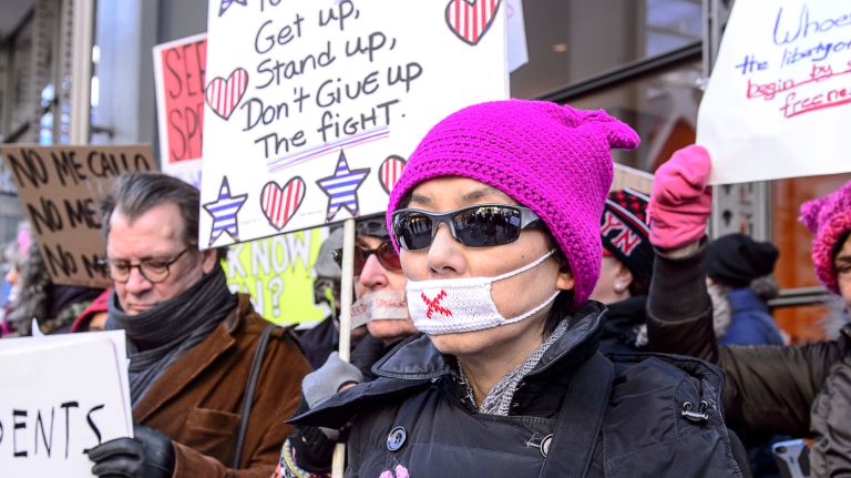 Protesters show support for the New York Times as they gather outside the newspaper's building in midtown Manhattan during the March for a Free Press on Feb. 26, 2017.