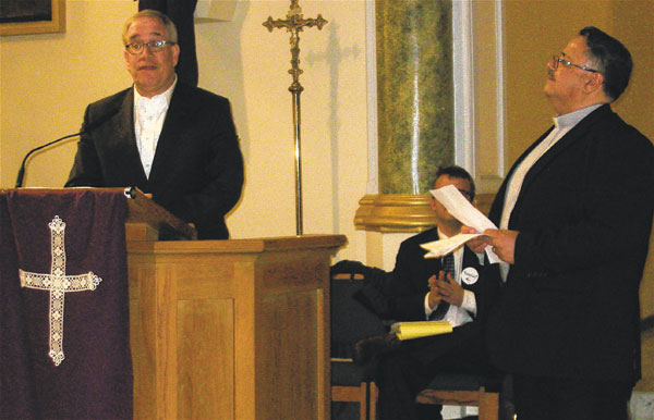 Interfaith Outrage on Housing and Special Education 2 Reverend Getulio Cruz (right), from Monte Sion Christian Church, looked on, as Comptroller Scott Stringer (at podium) gave his remarks at the Manhattan Together gathering. Photo by Lesley Sussman.
