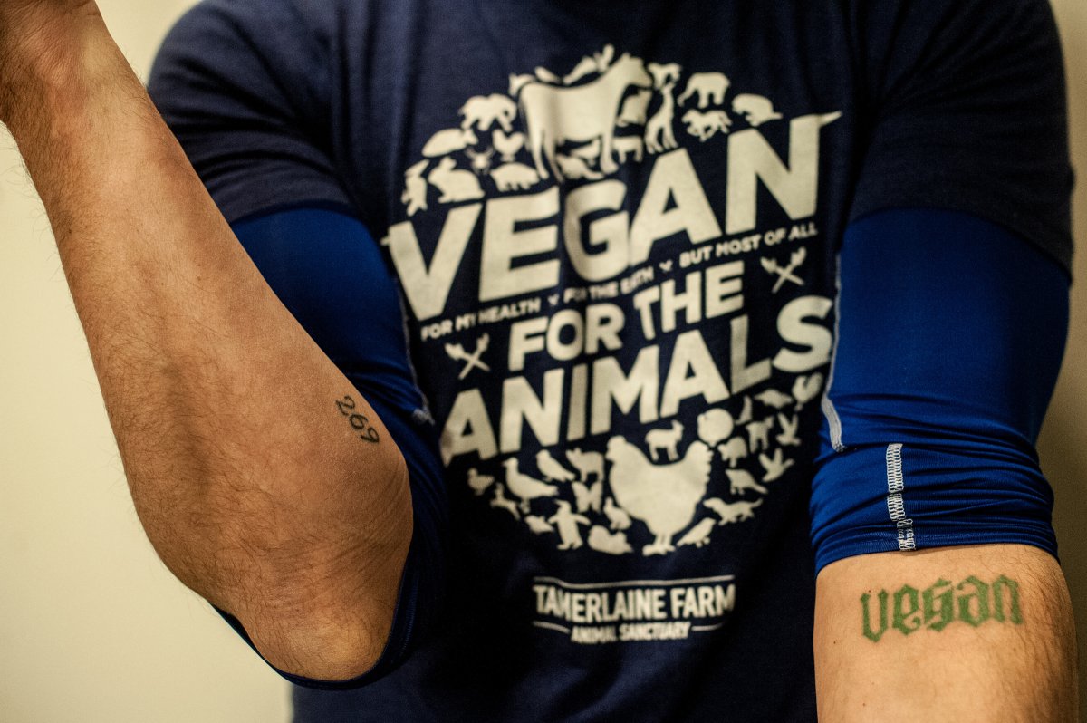 Nathan Semmel shows his "269" and "Vegan" tattoos.