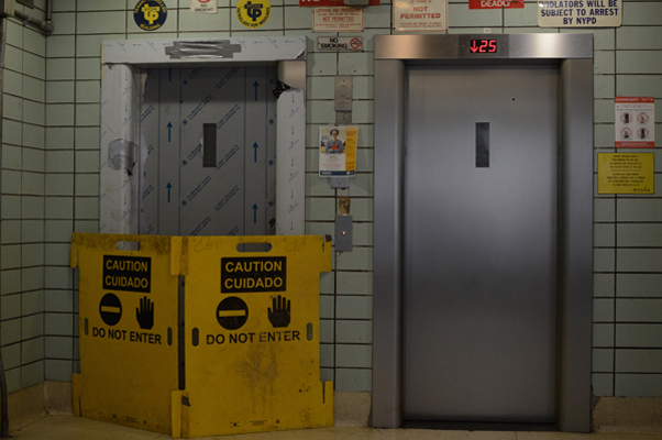 A sight nobody wants to come upon in a 25-story building, here at the Holmes Towers, where new elevators are in the final month of installation. | JACKSON CHEN 