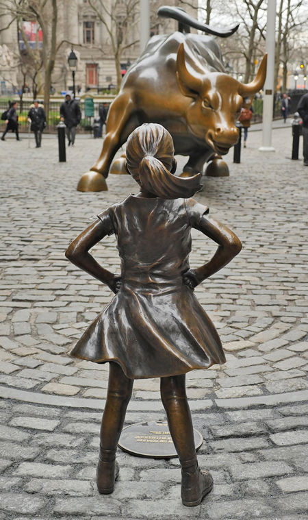 Photo by Milo Hess The sculpture, called “The Fearless Girl,” by artist Kristen Visbal was placed at the northern tip of Bowling Green facing down the iconic “Charging Bull” late Tuesday, on the eve of International Women’s Day, as part of a campaign by finance company State Street Corporation to promote women in leadership in the financial sector.