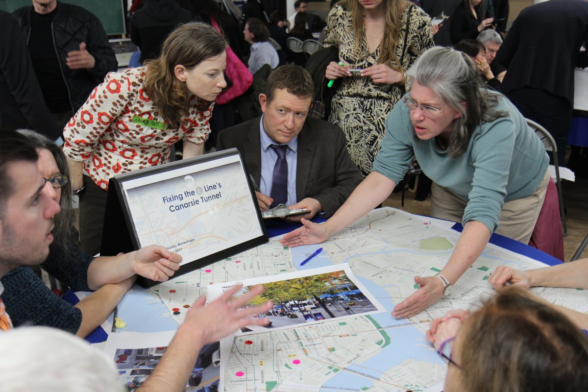 Each table at the workshop drew up routes and options on city maps. Photo by Dennis Lynch