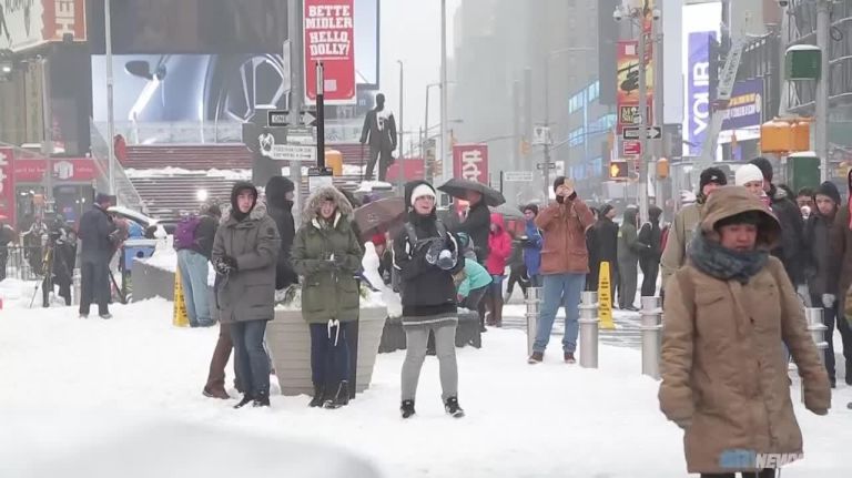 Tourists enjoying the snow in NYC