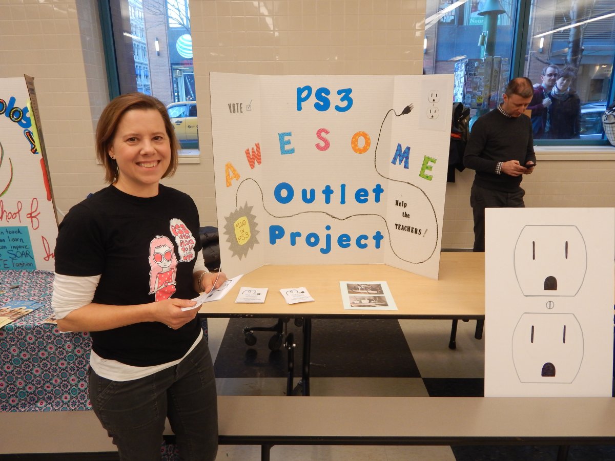 Photo by Sean Egan Hoping to make a connection: At the P.B. project expo, Nicole Barth stumped for funds to update the electrical system at P.S. 3 in the Village. Photo by Sean Egan
