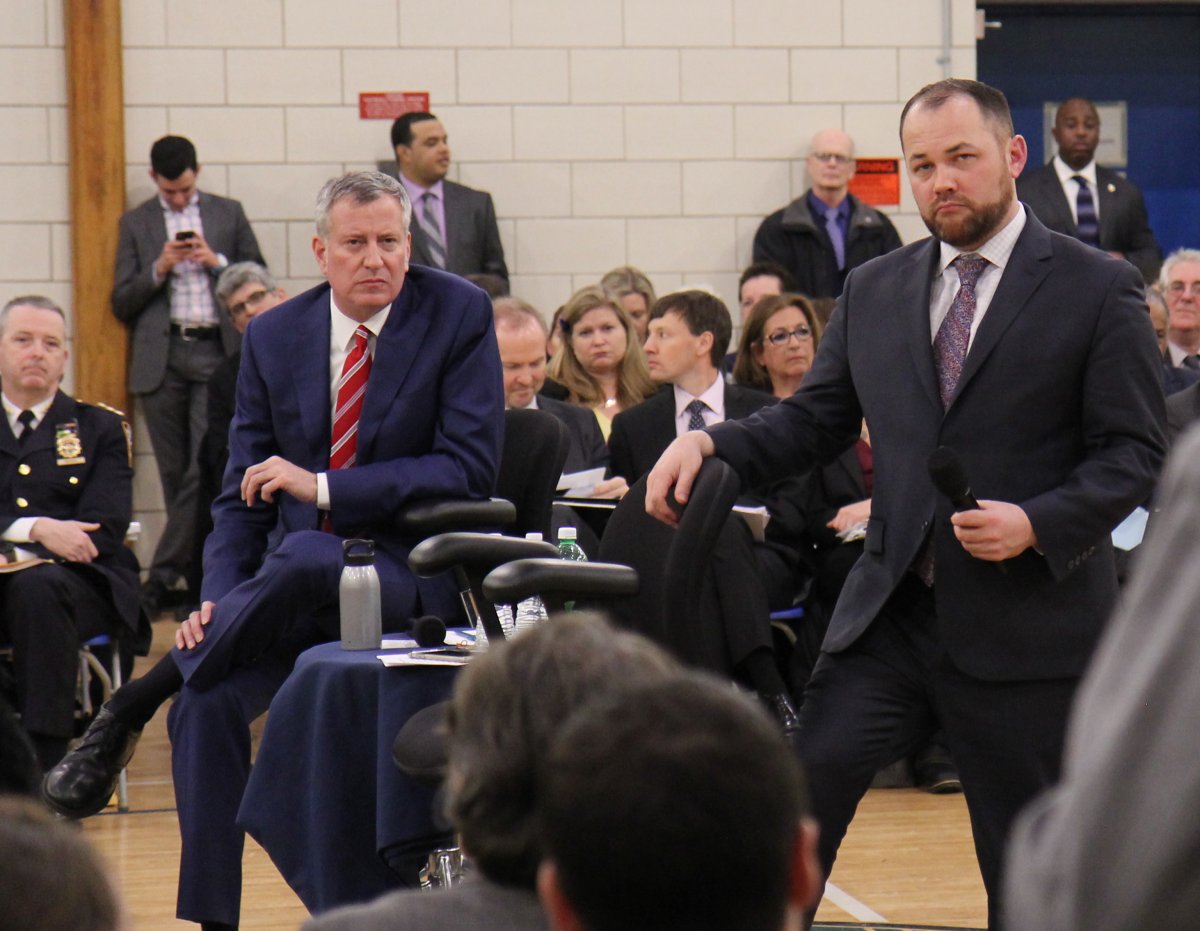 Both Mayor Bill de Blasio, left, and Councilmember Corey Johnson — above, at the recent town hall for Council District 3 — have questioned the legality of the Small Business Jobs Survival Act. That’s been City Hall’s default response for years. At the town hall, Johnson dubbed the S.B.J.S.A. a form of “commercial rent control,” which advocates say it is not, and furthermore — and incorrectly, the writer charges — claimed that the state Legislature would have to approve such a measure, which is why it will never happen. Photo by Dennis Lynch