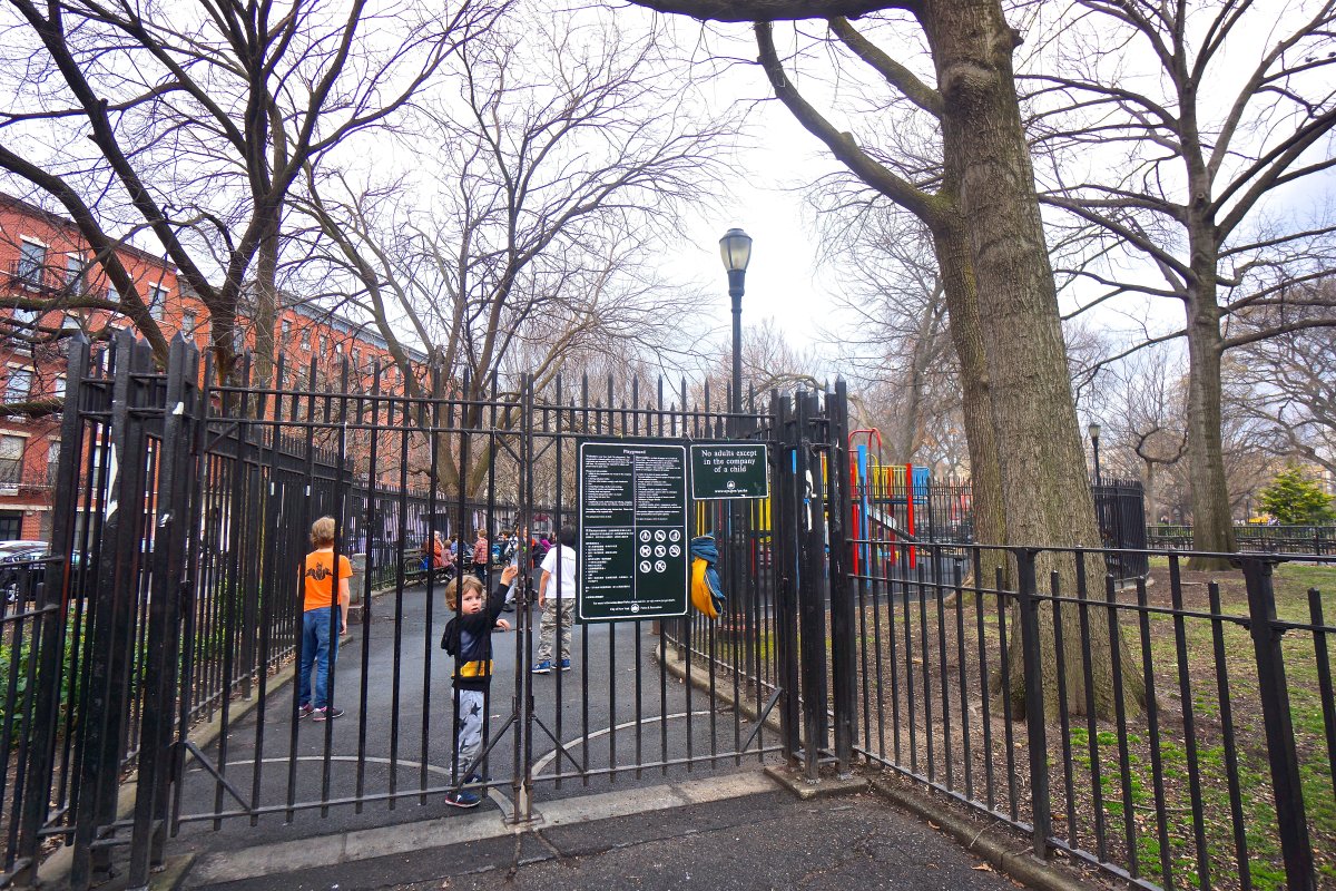 The playground on Tompkins Square Park’s Avenue B side between E. Seventh and Eighth Sts. It has a 7-foot fence enclosing the play area, which is surrounded by a 4-foot perimeter fence. The proposed new design would lower the inside fence to 4 feet.