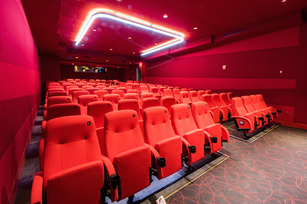 Each of the four screening rooms has a distinct color: blue, black, gray, and, seen here, red. Photo by Caleb Caldwell.