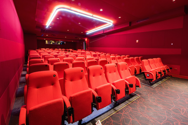 Renovated Quad Cinema corners its niche 5 Each of the four screening rooms has a distinct color: blue, black, gray, and, seen here, red. Photo by Caleb Caldwell.