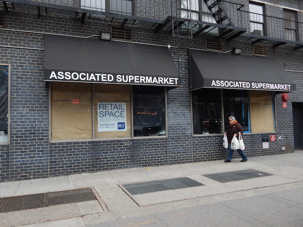 A view of the shuttered Associated supermarket at W. 14th St. and Eighth Ave., which was forced out in 2016 after facing a massive rent hike. Photo by Sean Egan.