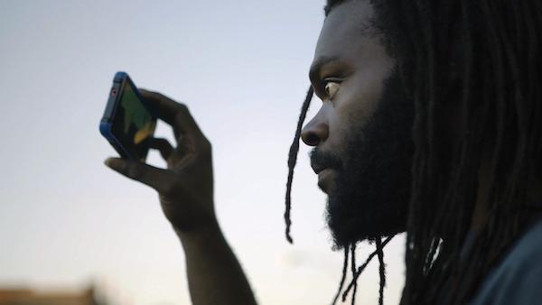 Kevin Moore films police activity in “Copwatch.” Photo by Adriel Gonzalez.