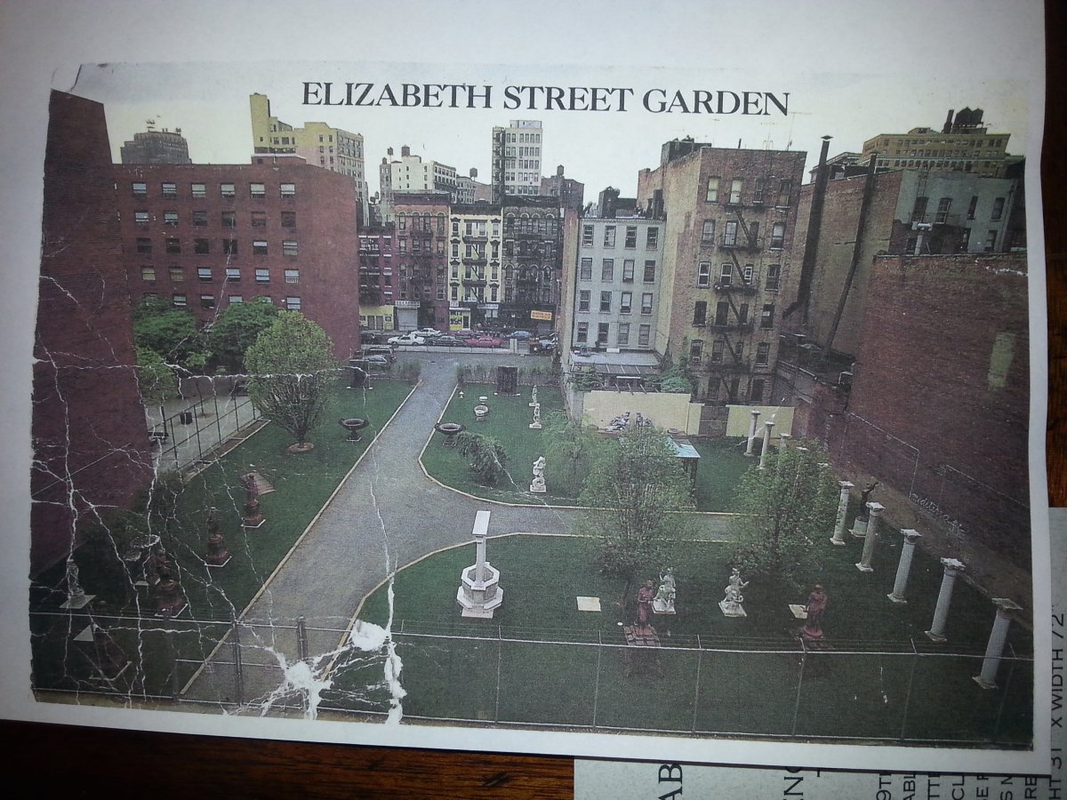 A shot by renowned photographer Jay Maisel of the then-newly created Elizabeth Street Garden in 1991, taken from the rooftop of 210 Elizabeth St., where his friend Allan Reiver formerly lived. “He took the picture the day I finished the garden,” Reiver recalled. This is the last postcard of a batch that Reiver had made up with this photo. Reiver later relocated across the street into a former firehouse. Photo by Lincoln Anderson