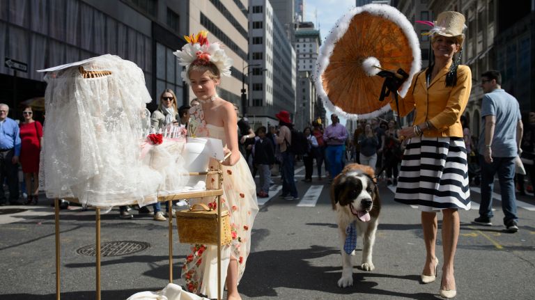 Manhattan residents Evita Staun-List, left, and her mother, Heidi Staun-Lusk, right, stroll along Fifth Avenue during the Easter Parade and Bonnet Festival in Manhattan on Sunday, April 16, 2017. 