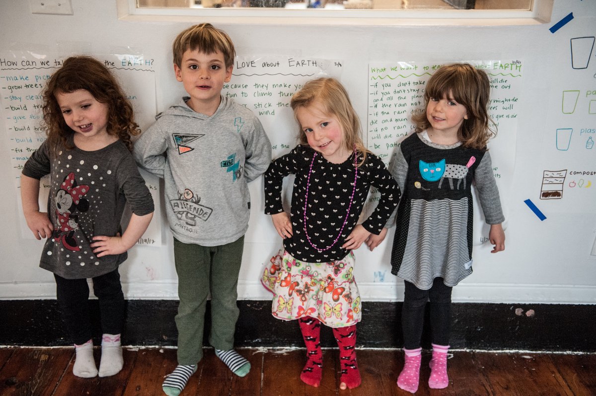 From left, Arielle Lubetzky, 4, Kamil Wood, 4 1/4, Viv Paulsen, 4, and Carlotta Strepparava, 3 ¾, at the Little Missionary’s Day Nursery, announced the launch of programs in the East Village school and in the students' homes that will focus on composting, recycling and educating litter bugs. They held a press conference in their classroom and went to Tompkins Square Park to pick up trash under the Hare Krishna Tree. Photos by Rebecca White