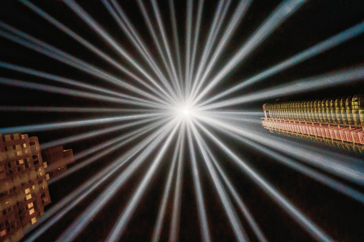 An award-winning perspective on the 9/11 “Tribute in Light.” Milo Hess took this shot standing in the footprint of one of the massive twin beams, which are, in fact, each made up of multiple lights. Photo by Milo Hess