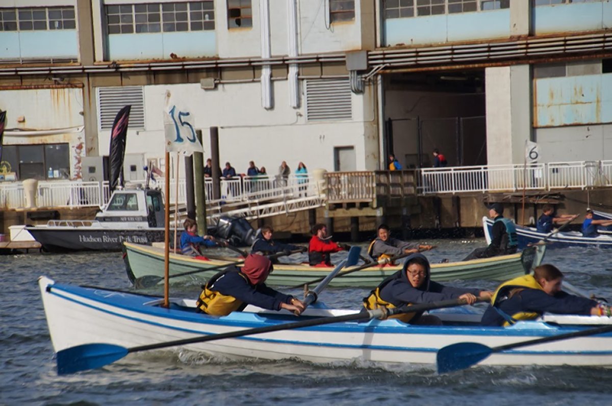 Local students race Whitehall boats in the protected Hudson River embayment south of Pier 40, where Village Community Boathouse is located. Photo courtesy Village Community Boathouse