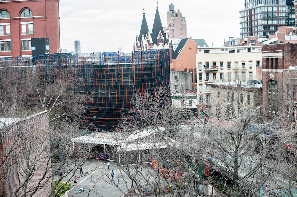 Construction work is currently going on to expand St. Luke's School, in background. Plans are to include recreational space for the students atop the roof of the school's new second floor.