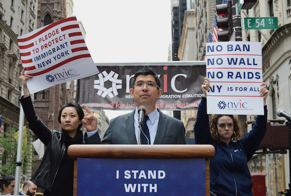 City Councilmember Carlos Menchaca speaks to immigration rights advocates assembled several blocks below Trump Tower. | JACKSON CHEN