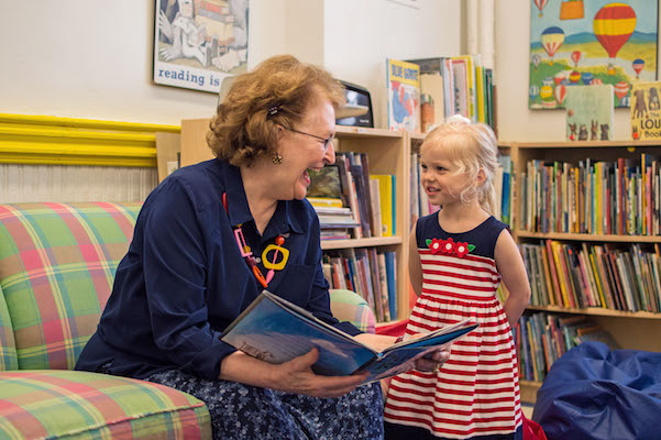 Betsy Newell in her office at Park Children’s Day School, where she serves as director, with a young student there. | JACKSON CHEN 