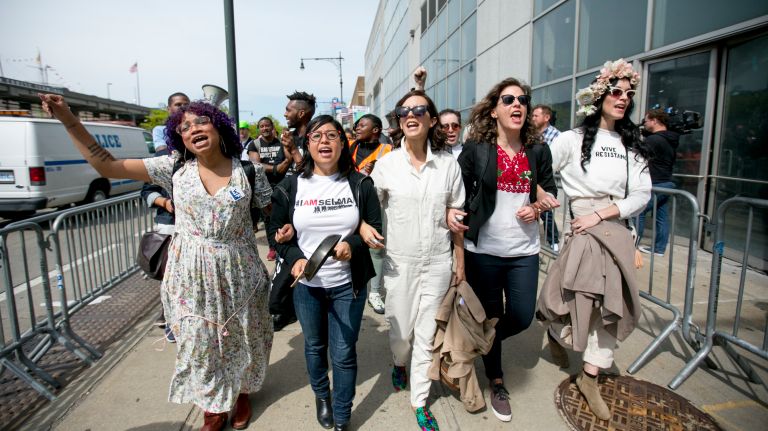 Anti-Trump demonstrators chant as they march down the West Side Highway in Manhattan before President Donald Trump's arrival at the Intrepid Sea, Air & Space Museum on Thursday, May 4, 2017.