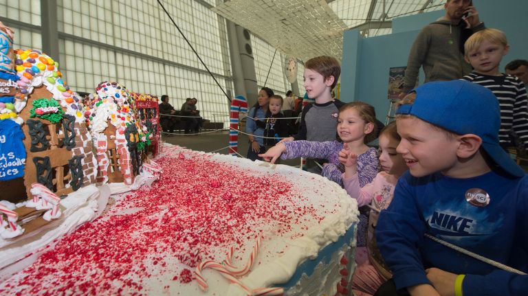 Noah Greenblatt, 8, Chiara Minerva , 5, Ariel Greenblatt, 5, and Nicholas Minerva, 8, check out GingerBread Lane on Nov. 26, 2017.